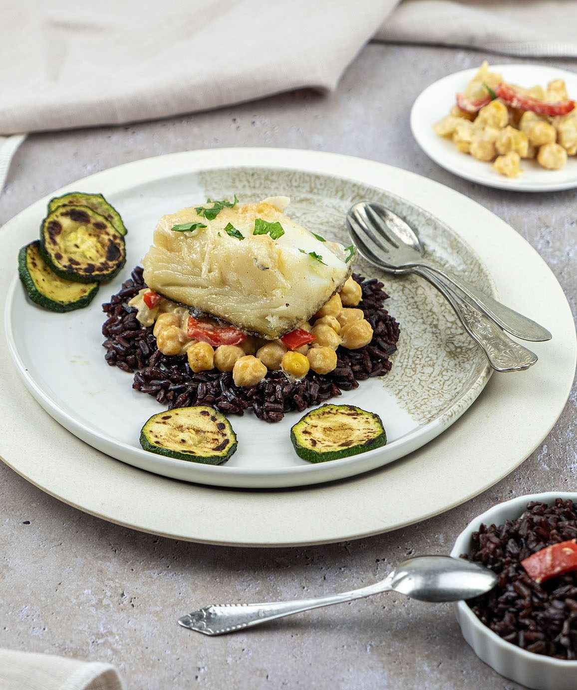 Bacalhau met zwarte rijst en kokosmelk